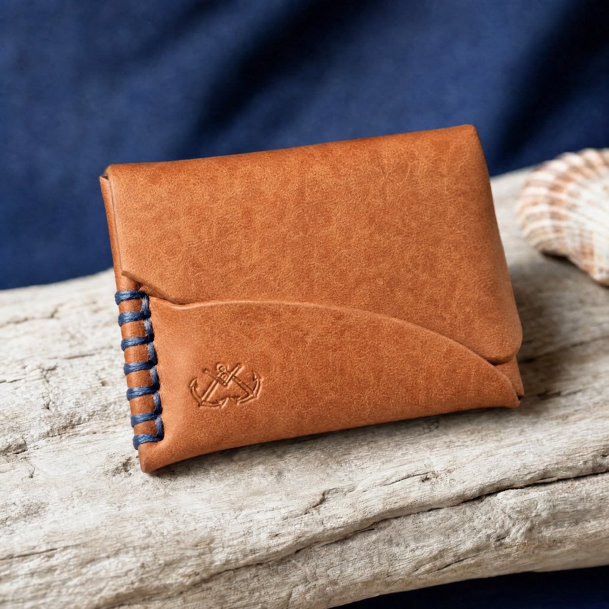 The Buccaneer flap card wallet in Cognac Pueblo leather on driftwood