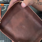 The Stowaway held in two hands